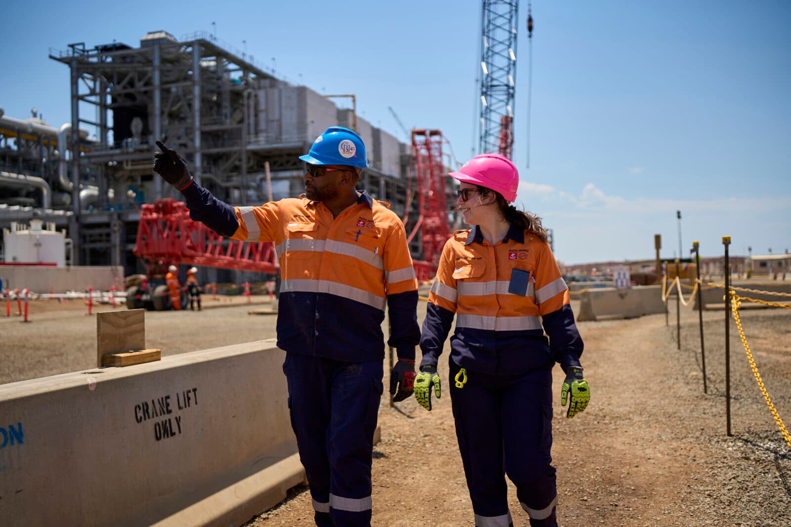 Mentor showing apprentice around the construction site